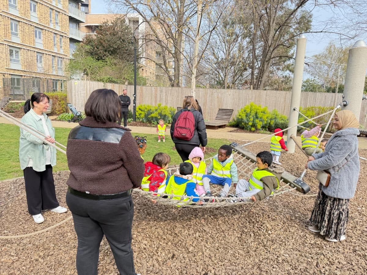 destiny haven nursery children in high visibility vests playing in sand