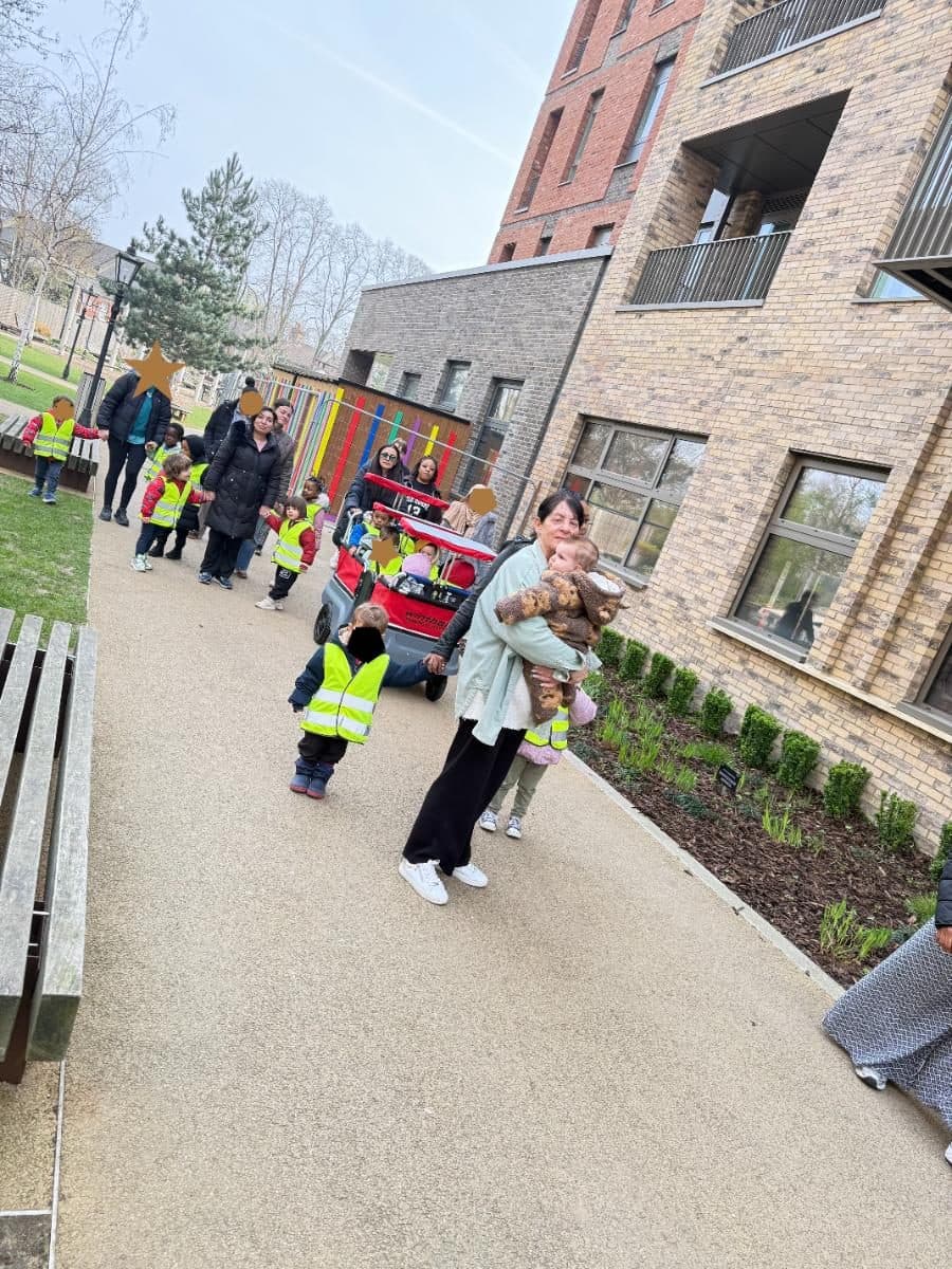destiny haven nursery children in highvisibility vests walk along a paved path