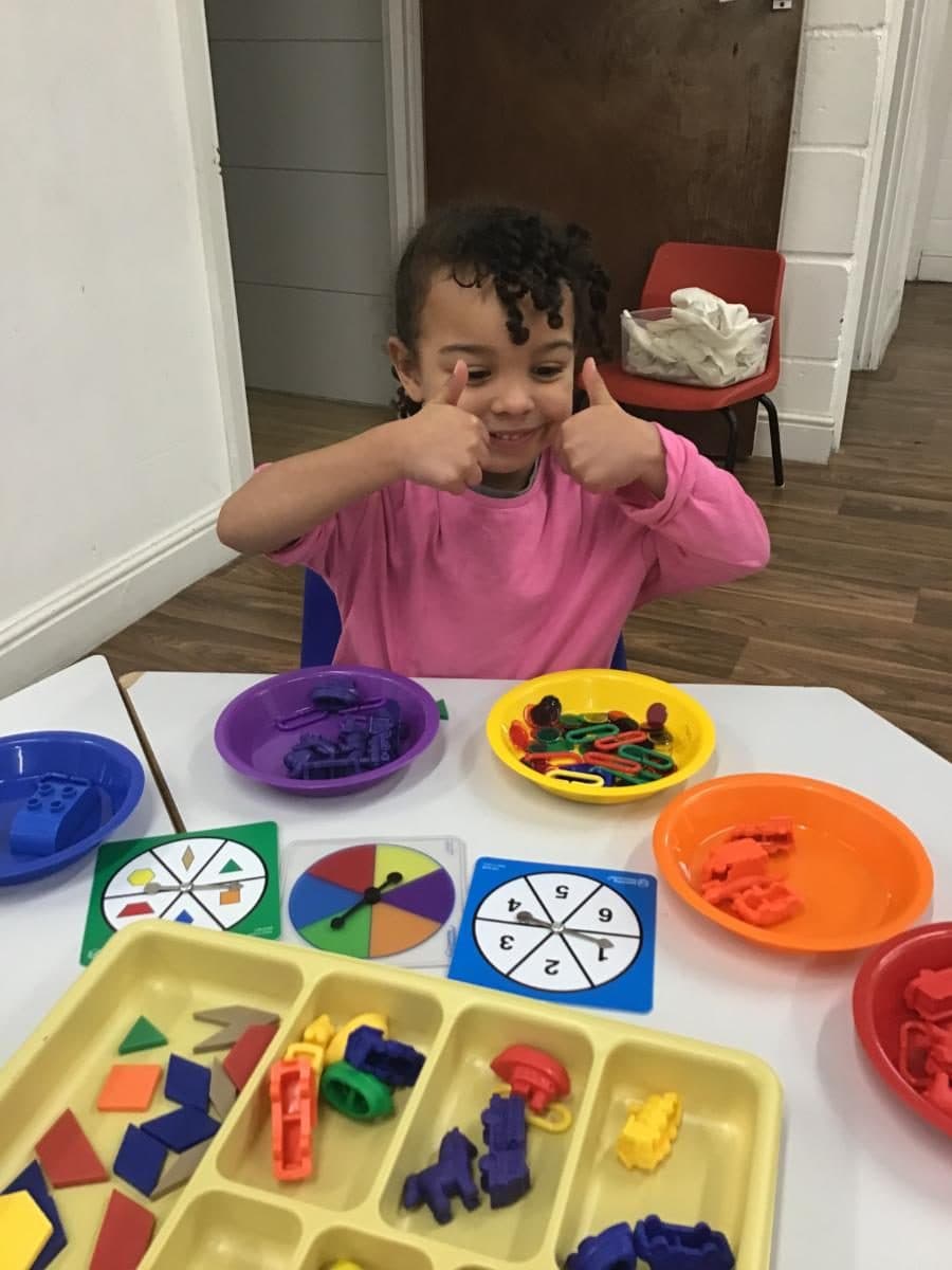 destiny haven nursery learning activity with colorful sorting trays