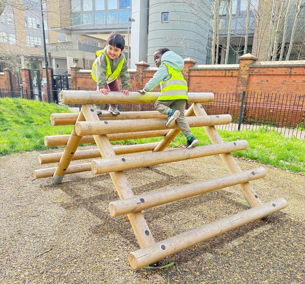 destiny haven nursery nursery children play on wooden climbing equipment