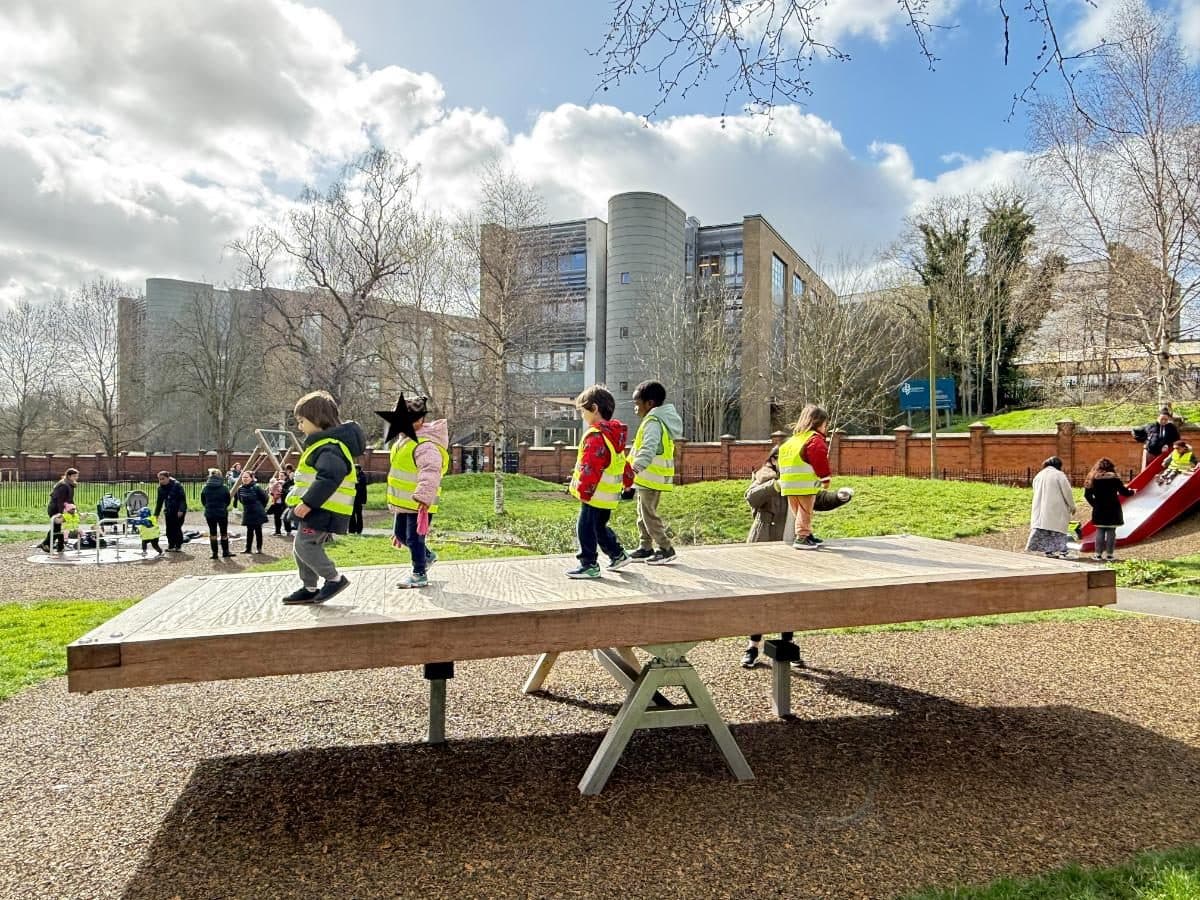 destiny haven nursery outdoor playground with a wooden balance beam