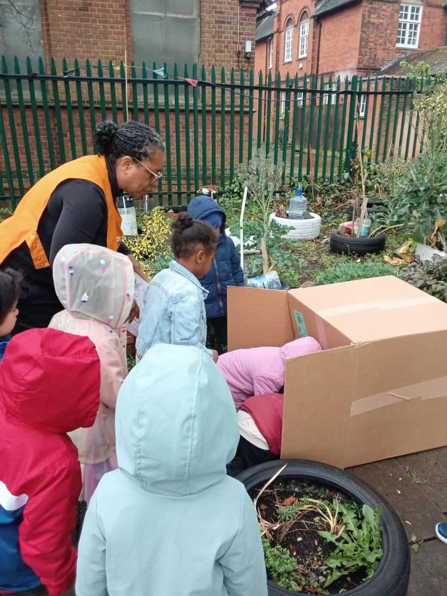 destiny haven nursery children exploring a community garden with vegetables