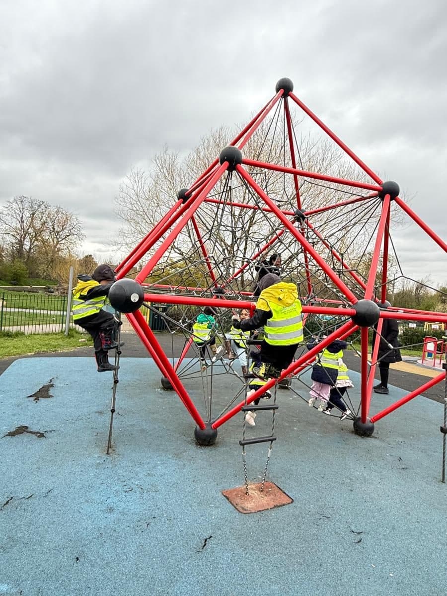 destiny haven nursery nursery children enjoy climbing on a red geometric playground